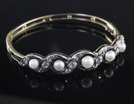 An Edwardian gold, pearl and diamond hinged bangle,